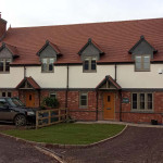 Red brick and cream house